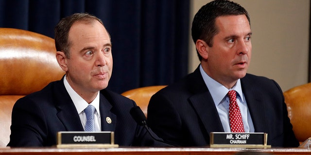 House Intelligence Committee Chairman Rep. Adam Schiff, D-Calif., left, and ranking member Rep. Devin Nunes, R-Calif., look on during a hearing of the House Intelligence Committee on Capitol Hill in Washington, Wednesday, Nov. 13, 2019, during the first public impeachment hearing of President Donald Trump's efforts to tie U.S. aid for Ukraine to investigations of his political opponents. (AP Photo/Alex Brandon)