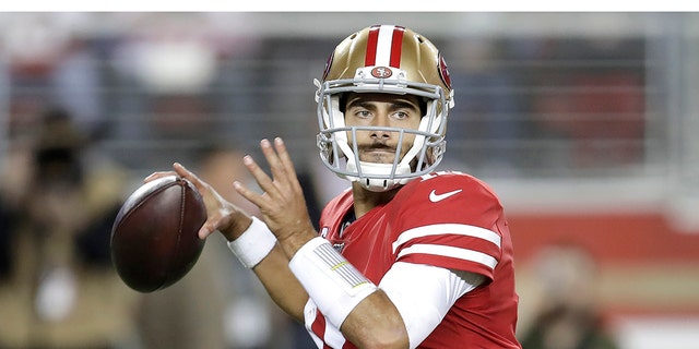 San Francisco 49ers quarterback Jimmy Garoppolo (10) passes against the Green Bay Packers during the first half of an NFL football game in Santa Clara, Calif., Sunday, Nov. 24, 2019. (AP Photo/Ben Margot)