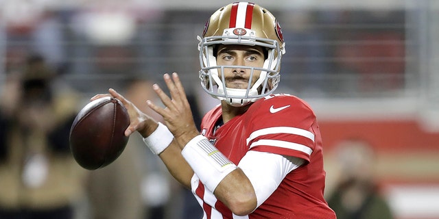 San Francisco 49ers quarterback Jimmy Garoppolo (10) passes against the Green Bay Packers during the first half of an NFL football game in Santa Clara, Calif., Sunday, Nov. 24, 2019. (AP Photo/Ben Margot)
