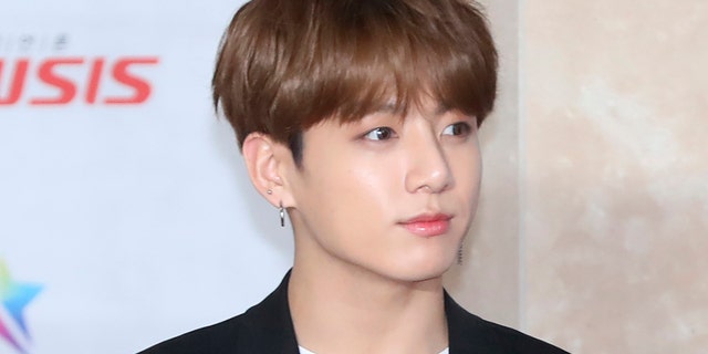 In this Nov. 28, 2018, photo, a member of K-pop group BTS, Jungkook, poses for the media at the Asia Artist Awards in Incheon, South Korea. Police say they are investigating Jungkook over a traffic accident on Saturday, Nov. 2, 2019, involving the band member and a taxi driver.