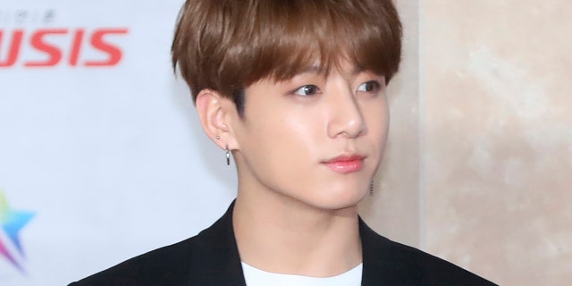 In this Nov. 28, 2018, photo, a member of K-pop group BTS, Jungkook, poses for the media at the Asia Artist Awards in Incheon, South Korea. Police say they are investigating Jungkook over a traffic accident on Saturday, Nov. 2, 2019, involving the band member and a taxi driver.