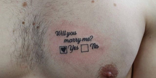 Tattoo artist Juris Jurison completed the body art, commenting that marriage-proposal tattoos have not been “a common occurrence” in the two years he’s worked at the parlor.
