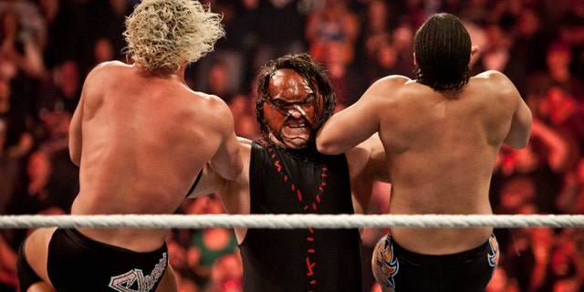 Kane, taking two top stars down during the WWE Raw event at Rose Garden arena in Portland, Ore., Monday February 27th, 2012. (Photo by Chris Ryan/Corbis via Getty Images)