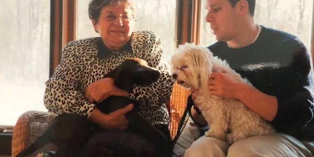 One of the family's favorite Thanksgiving traditions involves a Labrador, a Maltese and a hilarious, annual photo-op.