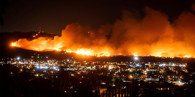 Smoke from the Maria Fire billows above Santa Paula, Calif., on Thursday night. (AP)