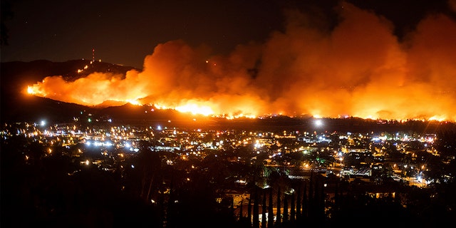 Smoke from the Maria Fire billows above Santa Paula, Calif., on Thursday night. (AP)