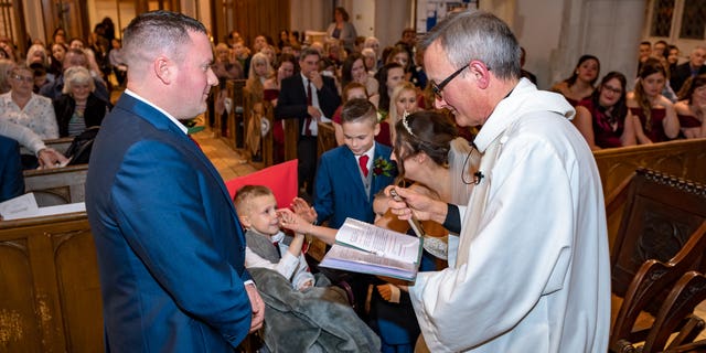 Ethan watched alongside his two brothers as his mom, Hannah Colishaw, married Henry Matthews. 