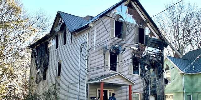 Investigators work the scene of an overnight fire that killed Lt. Jason Menard, Wednesday, Nov. 13, 2019 in Worcester, Mass.