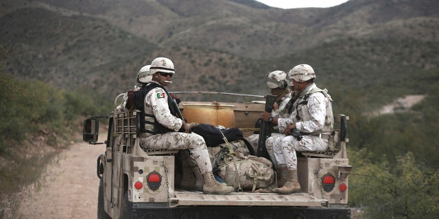 Mexican national guardsmen patrol near Bavispe, at the Sonora-Chihuahua border, Mexico, Wednesday, Nov. 6, 2019. 