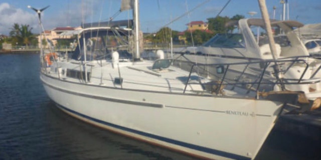 The Coast Guard had said three people were on board the 40-foot sailboat named Dove.