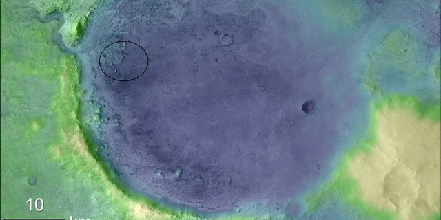 Lighter colors represent higher elevation in this image of Jezero Crater on Mars, the landing site for NASA's Mars 2020 mission. The oval indicates the landing ellipse, where the rover will be touching down on Mars. Credits: NASA/JPL-Caltech/MSSS/JHU-APL/ESA
