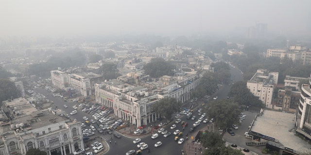 Delhi's skyline is seen enveloped in smog and dust in on Friday. (AP Photo/Manish Swarup)