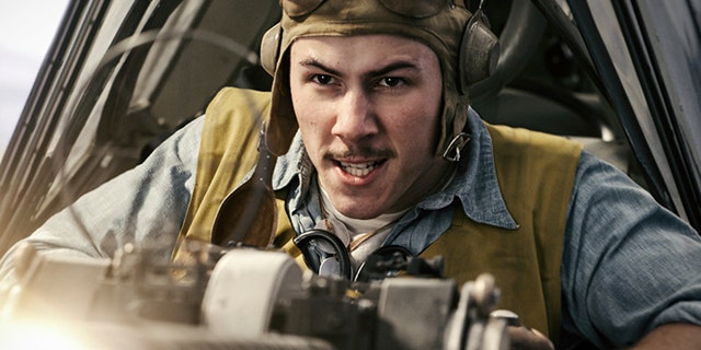 This image released by Lionsgate shows Nick Jonas in a scene from "Midway." (Reiner Bajo/Lionsgate via AP)