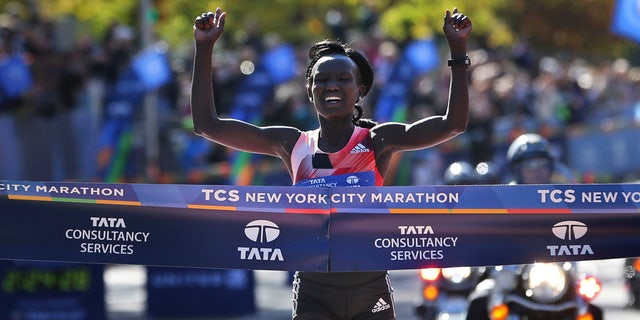 In this Nov. 6, 2016, file photo, Mary Keitany of Kenya crosses the finish line first in the women's division of the 2016 New York City Marathon. The 37-year-old from Kenya will try for her fifth women's title in six years at the New York City Marathon on Sunday, Nov. 3, 2019.