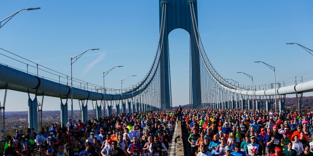 In this Nov. 4, 2018, file photo, runners cross the Verrazano-Narrows Bridge during the New York City Marathon.