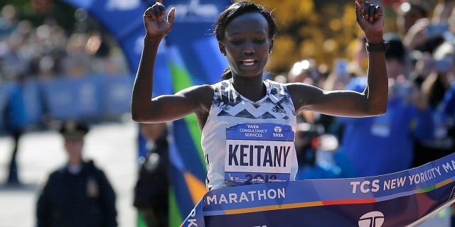 In this Nov. 4, 2018, file photo, Mary Keitany, of Kenya, crosses the finish line to win the women's division of the New York City Marathon in New York.
