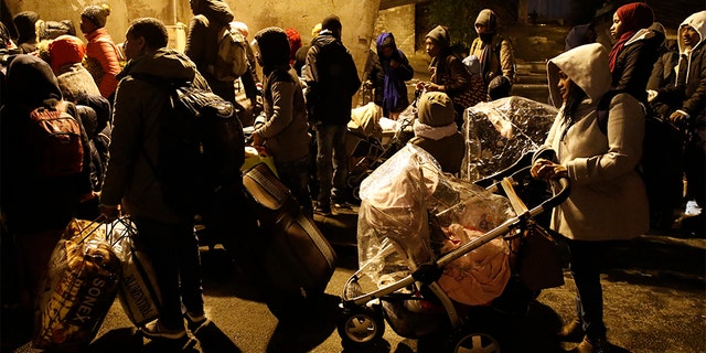 The migrants were bused away to several facilities in and around Paris Thursday after they were removed from the camps.