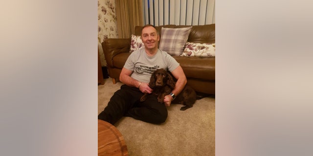 Robert Alcock and his cocker spaniel, Coco.