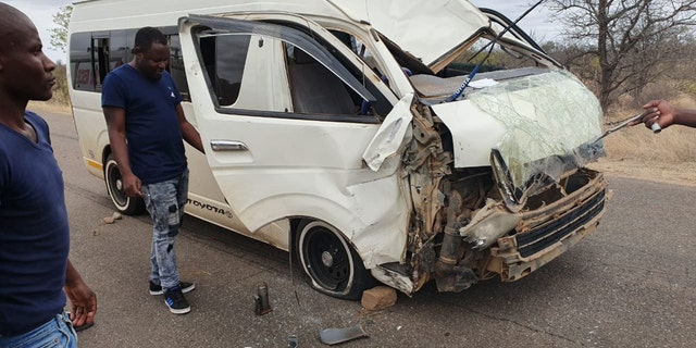 The giraffe was struck by a minibus and then sent careening into another vehicle.