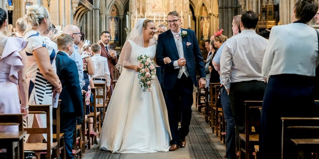 Emma Kitson walking on her wedding day.