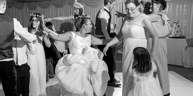 Emma Kitson dancing on her wedding day in her wheelchair.