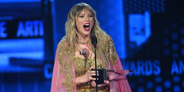 Taylor Swift accepts the award for artist of the decade at the American Music Awards on Sunday, Nov. 24, 2019, at the Microsoft Theater in Los Angeles