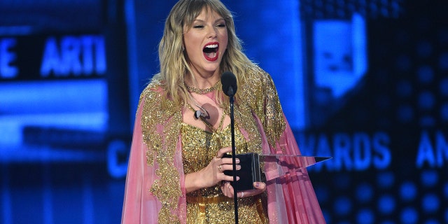 Taylor Swift accepts the award for artist of the decade at the American Music Awards on Sunday, Nov. 24, 2019, at the Microsoft Theater in Los Angeles
