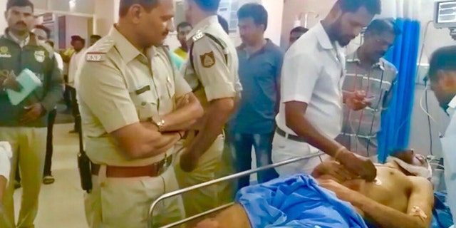 Police were called and rescued the man, who they said had suffered "grievous injuries."