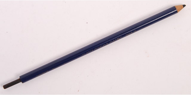 A rare original WWII Second World War SOE Special Operations Executive'Escape & Evade' secret dagger pencil. It is a normal'Royal Sovereign No.107' blue pencil but it has a secret large, metal spike dagger inside. (Credit: SWNS)