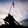 The sun sets behind the U.S. Marine Corps War Memorial in Arlington, Virginia, Nov. 10, 2019.