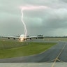 Lightning strikes near an Emirates A380 airplane at Christchurch Airport, New Zealand, Nov. 20, 2019. GCH Aviation/via REUTERS 