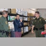 Acting Secretary of Homeland Security Chad Wolf talks with officers at the detention center in Donna, Texas.