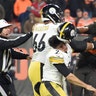 Myles Garrett of the Cleveland Browns hits Pittsburgh Steelers quarterback Mason Rudolph with his own helmet during a fight in the second half of their NFL game in Cleveland, Nov. 14, 2019. 