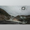 Bullet-riddled vehicles that members of the extended LeBaron family were traveling in sit parked on a dirt road near Bavispe, at the Sonora-Chihuahua state border, Mexico, Nov. 6, 2019.