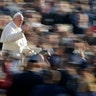 Pope Francis waves to faithful as he arrives for his weekly general audience in St. Peter's Square, at the Vatican, Nov. 27, 2019. 
