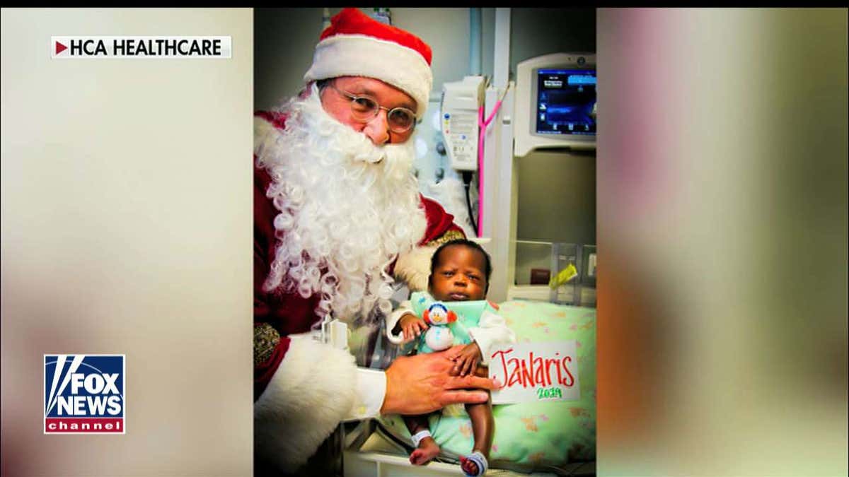 Janaris shows off his new snowman-themed knitwear.