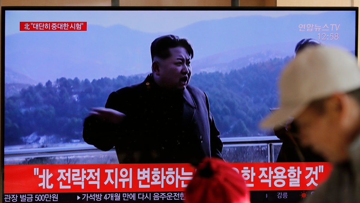 People watch a TV news program reporting North Korea's announcement with a file footage of North Korean leader Kim Jong Un, at the Seoul Railway Station in Seoul, South Korea, Sunday, Dec. 8, 2019. North Korea said Sunday it carried out a “very important test” at its long-range rocket launch site that U.S. and South Korean officials said the North had partially dismantled as part of denuclearization steps. The letters, top left, read "North. Very important test." (AP Photo/Lee Jin-man)