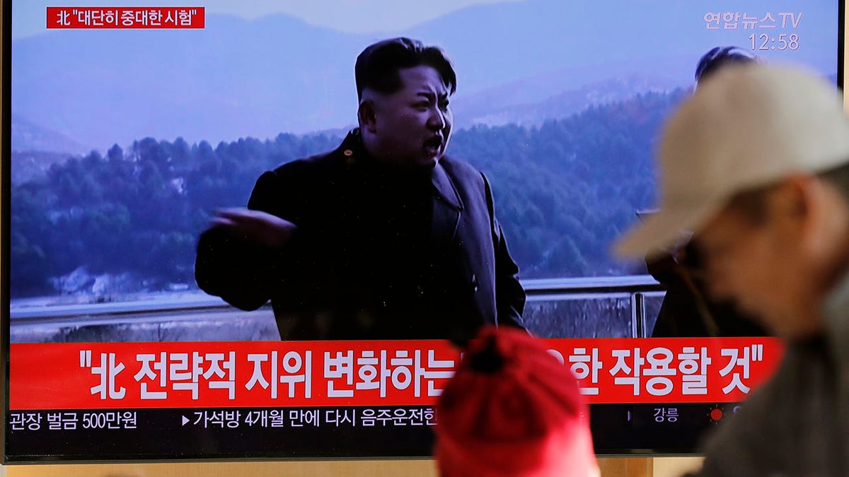 People watch a TV news program reporting North Korea's announcement with a file footage of North Korean leader Kim Jong Un, at the Seoul Railway Station in Seoul, South Korea, Sunday, Dec. 8, 2019. The letters, top left, read "North. Very important test." (Associated Press)