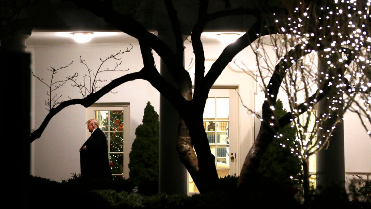 President Trump walking from the Oval Office as he headed to speak with reporters on the South Lawn of the White House before departing for the Pennsylvania rally Tuesday. (AP Photo/ Evan Vucci)