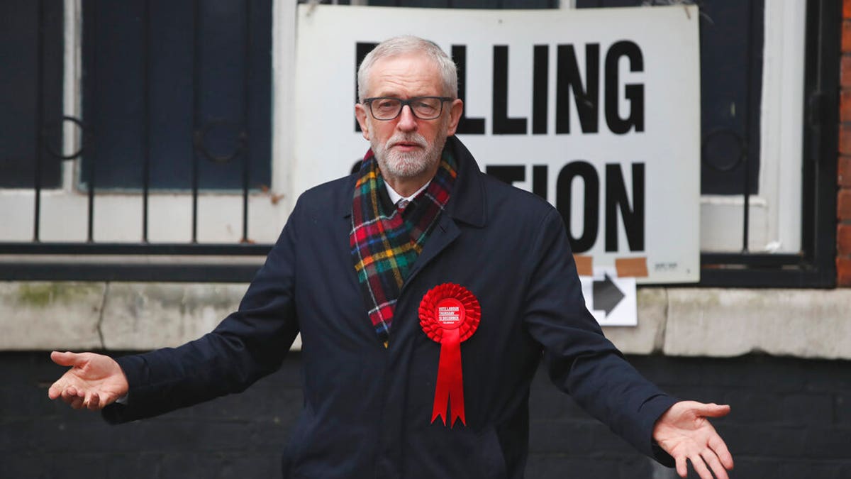 British opposition Labour Party leader Jeremy Corbyn, gestures after casting his vote in the general election, in Islington, London, England, Thursday, Dec. 12, 2019. (AP Photo/Thanassis Stavrakis)