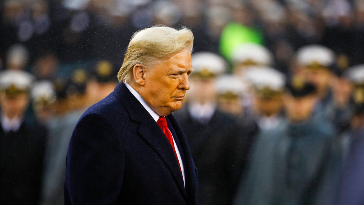 President Trump walks onto the field ahead of the annual Army-Navy football game, Dec. 14, 2019, in Philadelphia. (Associated Press)