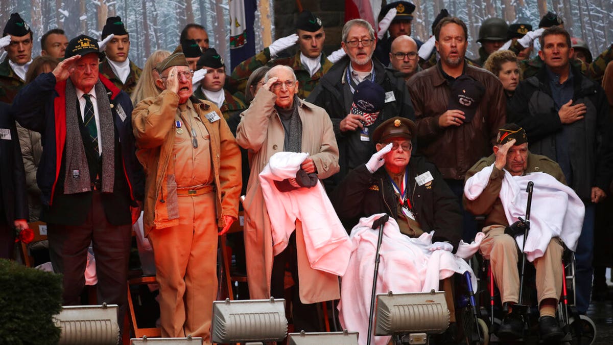 U.S. Battle of the Bulge veterans, front row, listen to the U.S. national anthem during a ceremony to commemorate the 75th anniversary of the Battle of the Bulge at the Mardasson Memorial in Bastogne, Belgium on Monday, Dec. 16, 2019. The Battle of the Bulge, also called Battle of the Ardennes, took place between Dec. 1944 and Jan. 1945 and was the last major German offensive on the Western Front during World War II.