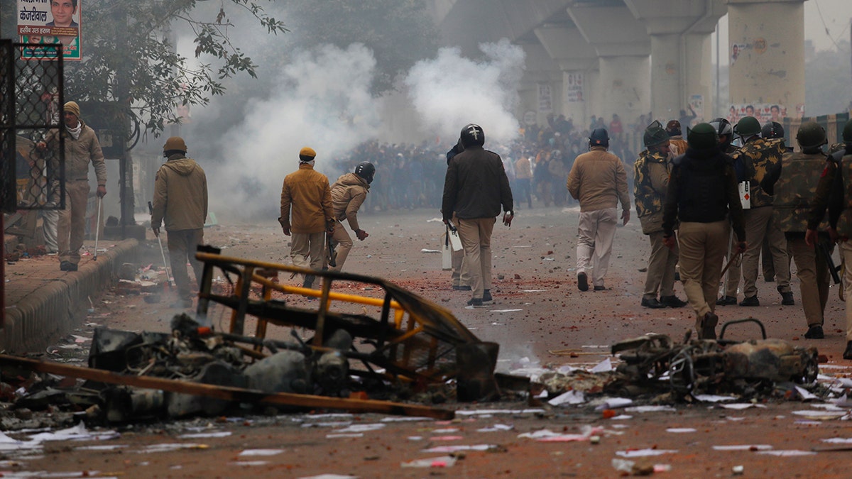 Police fired tear gas to push back protesters who swarmed to barricades and threw stones. Protests were also reported in the states of West Bengal, Kerala, Karnataka and elsewhere against the new law that provides a path to citizenship for non-Muslim migrants who entered the country illegally from several neighboring countries. (AP Photo/Manish Swarup)