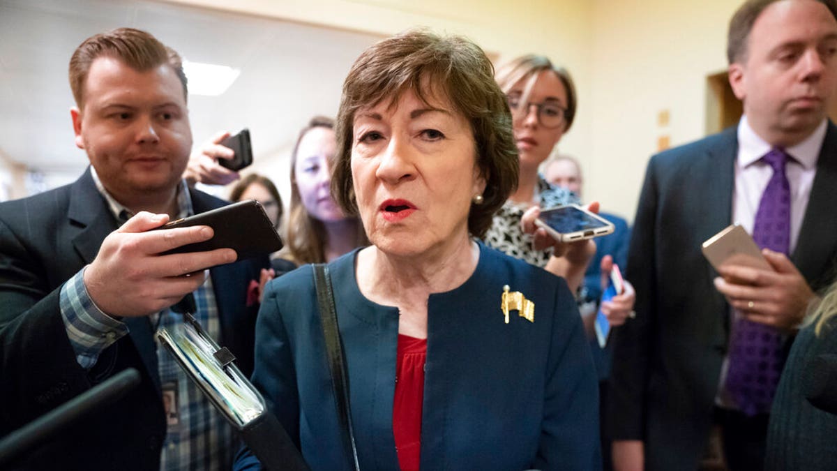 FILE - In this Nov. 6, 2019, file photo, Sen. Susan Collins, R-Maine, is surrounded by reporters as she heads to vote at the Capitol in Washington. U.S. Sen. Collins officially launched her bid for a reelection Wednesday, Dec. 18, setting up an expensive and closely watched battle for the seat the moderate Republican from Maine has held for nearly 24 years. (AP Photo/J. Scott Applewhite, File)