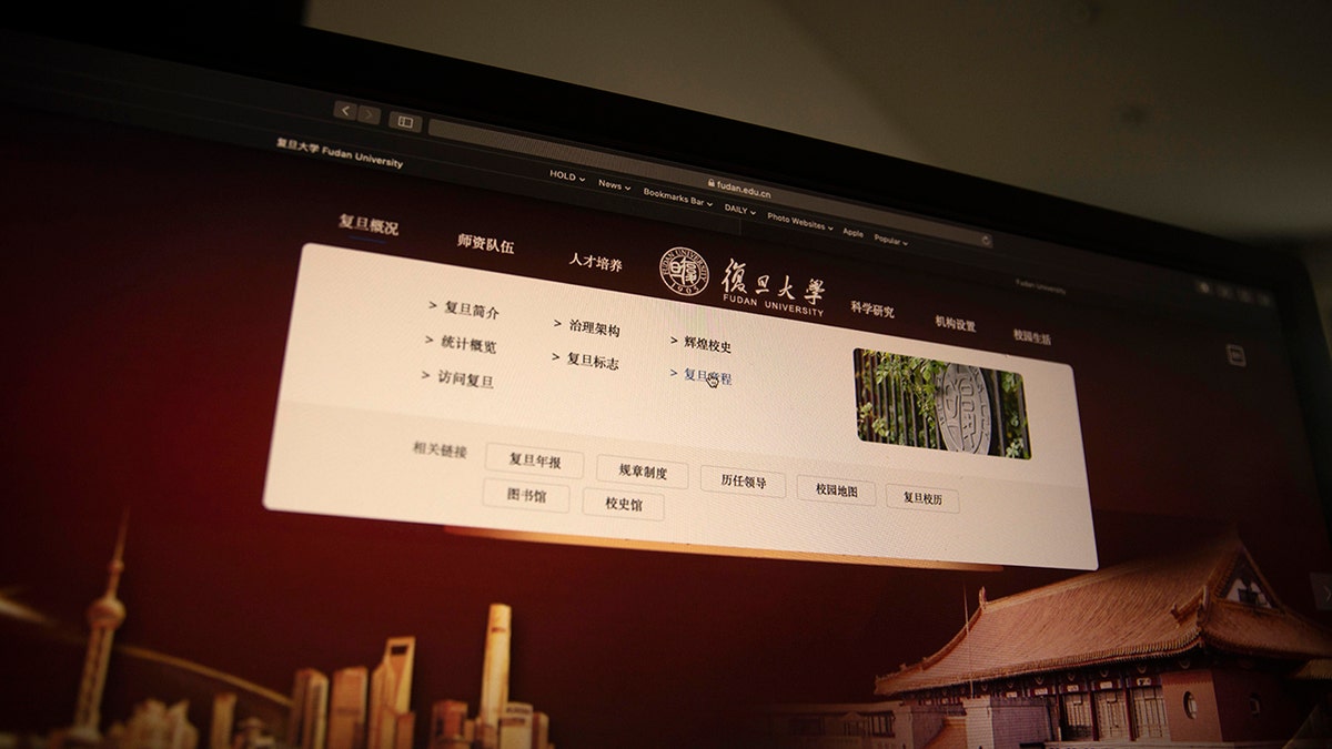 A computer screen shows the website of Fudan University with a link to the University charter in Beijing on Thursday, Dec. 19, 2019. (AP Photo/Ng Han Guan)