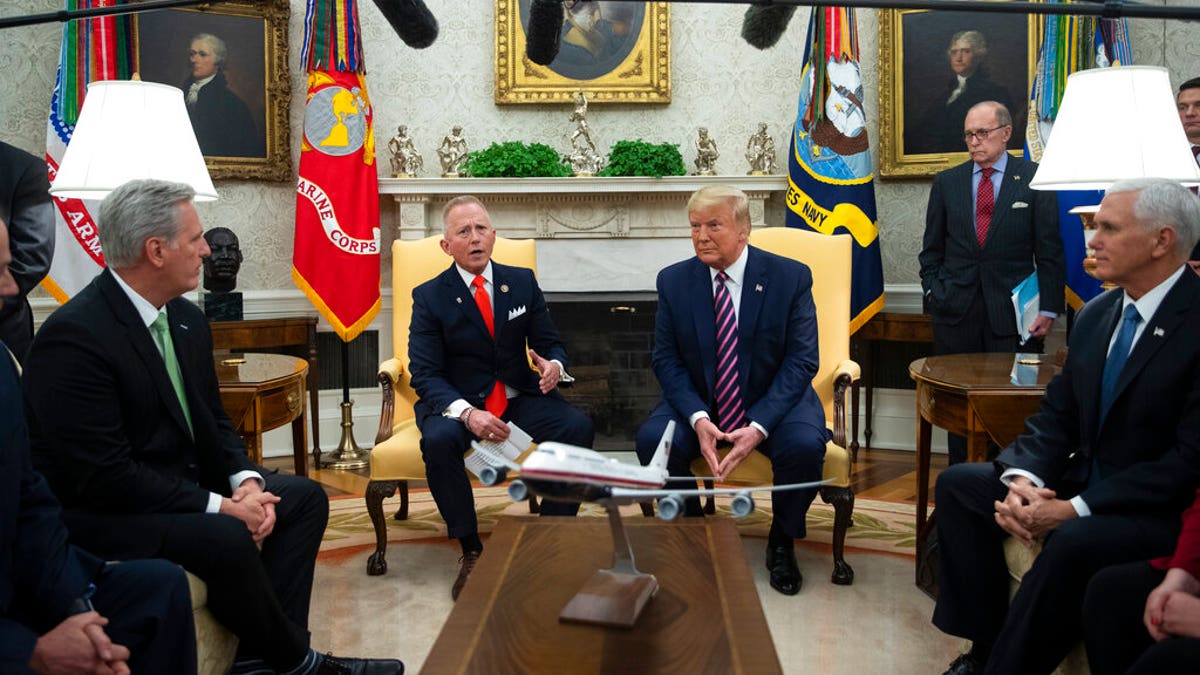 President Trump listens as Rep. Jeff Van Drew, D-N.J., who is planning to switch his party affiliation, speaks during a meeting in the Oval Office of the White House, Thursday, Dec. 19, 2019, in Washington. From left, House Minority Leader Kevin McCarthy of Calif., Van Drew, Trump, and Vice President Mike Pence. (AP Photo/ Evan Vucci)