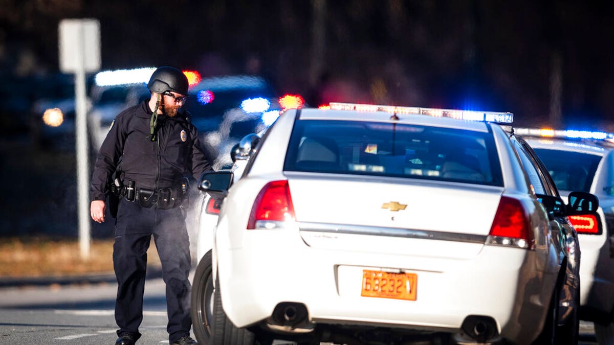 A police officer with the Winston-Salem Police Department responds to the Joycelyn V. Johnson Municipal Services Center after reports of gunshots in Winston-Salem, N.C. early Friday, Dec. 20, 2019. Winston- Salem Police are confirming there was a shooting but are not saying at this time if there are any injuries or deaths.