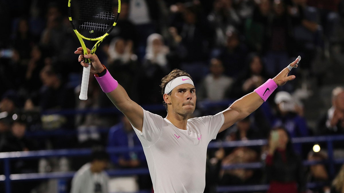 Rafael Nadal from Spain celebrates after defeating Stefanos Tsitsipas of Greece at the final match of the Mubadala World Tennis Championship in Abu Dhabi, United Arab Emirates, Saturday, Dec. 21, 2019. (AP Photo/Kamran Jebreili)