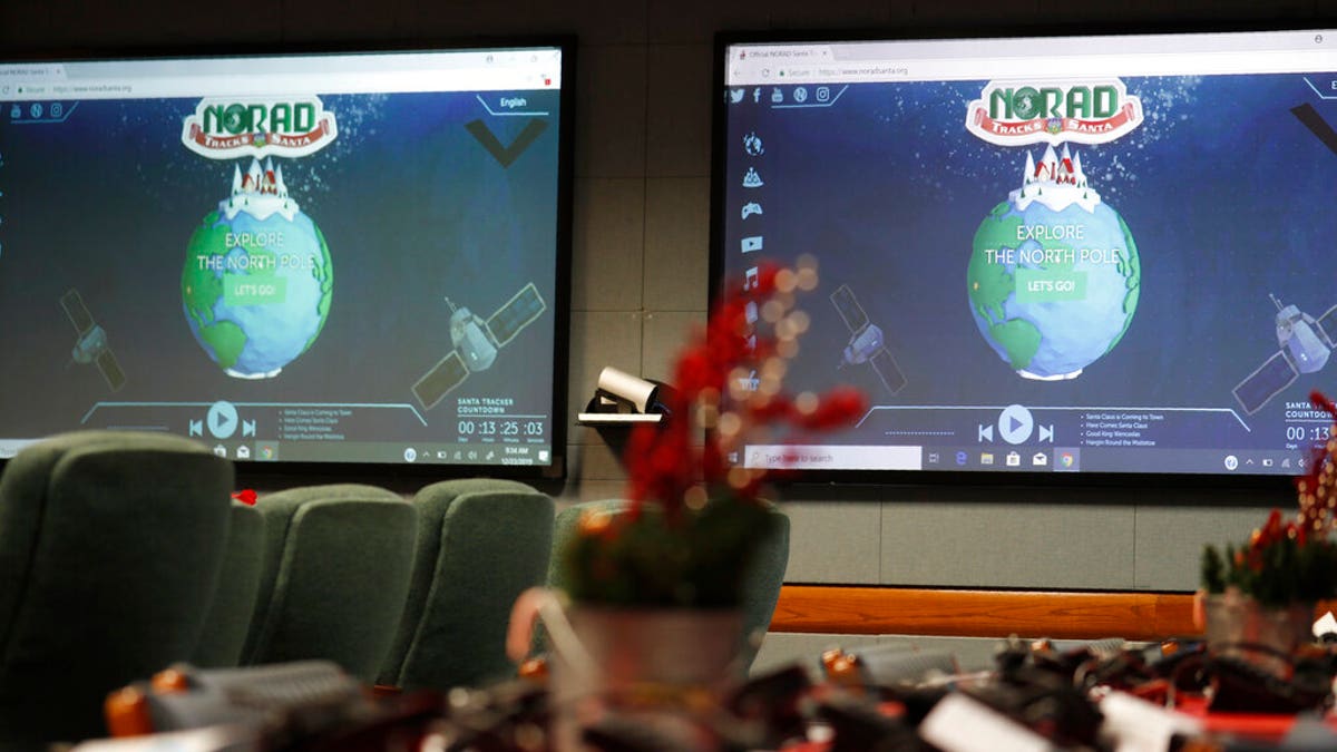 Monitors are illuminated in the NORAD Tracks Santa center at Peterson Air Force Base, Monday, Dec. 23, 2019, in Colorado Springs, Colo. More than 1,500 volunteers will answer an estimated 140,000 telephone calls from childfren and their parents who will be checking on the whereabouts of Santa Clau on Christmas Eve. 