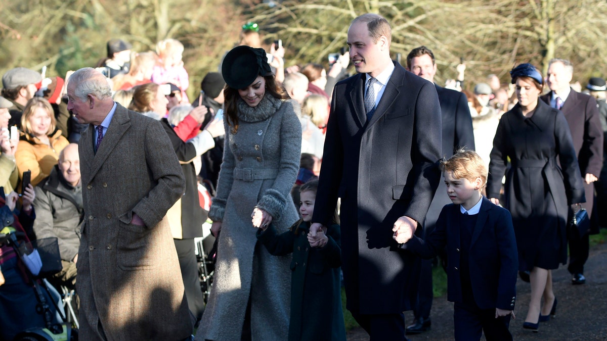 Britain's Prince Charles, Kate, Duchess of Cambridge, Prince William and their children Prince George, right, and Princess Charlotte arrive to attend the Christmas Day morning church service at St. Mary Magdalene Church in Sandringham, Norfolk, England, Wednesday, Dec. 25, 2019. (Joe Giddens/PA via AP)